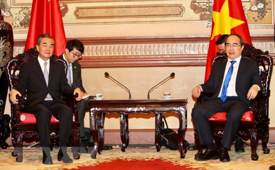 Politburo member Nguyen Thien Nhan meets Chinese State Councillor Wang Yi
