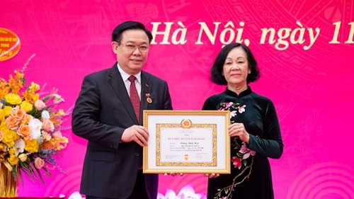 N.A. Chairman honored with 40-year Party membership badge